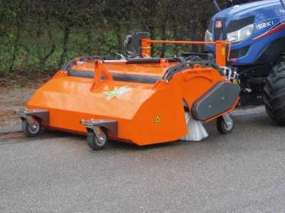 sweeper fitted to an Iseki tractor